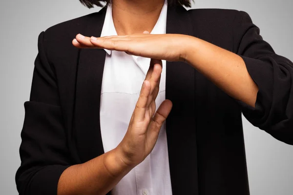 latin business woman doing break time gesture