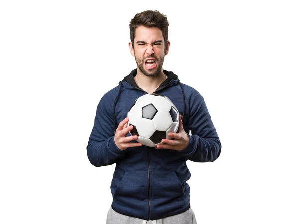 Angry Young Man Met Een Voetbal Geïsoleerd Witte Achtergrond — Stockfoto