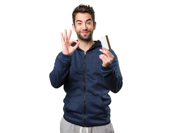 Young Man Holding Credit Card Doing Okay Gesture Isolated White — Stock Photo, Image