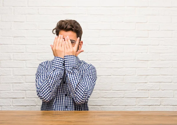 Young Caucasian Man Sitting Feels Worried Scared Looking Covering Face — Stock Photo, Image