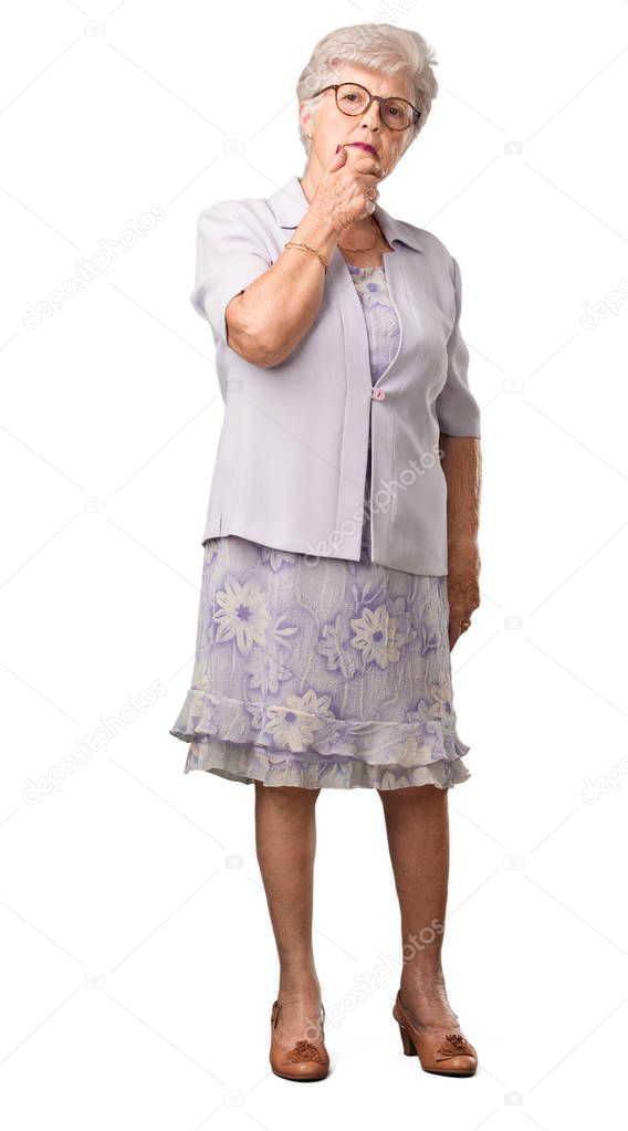 Full body senior woman thinking and looking up, confused about an idea, would be trying to find a solution