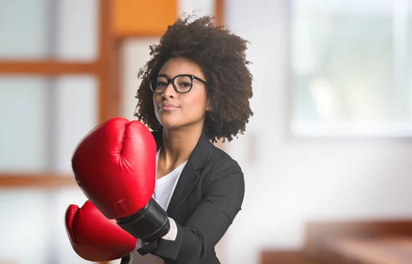 business black woman using boxing gloves