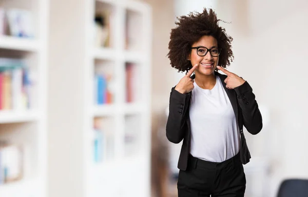 business black woman pointing mouth