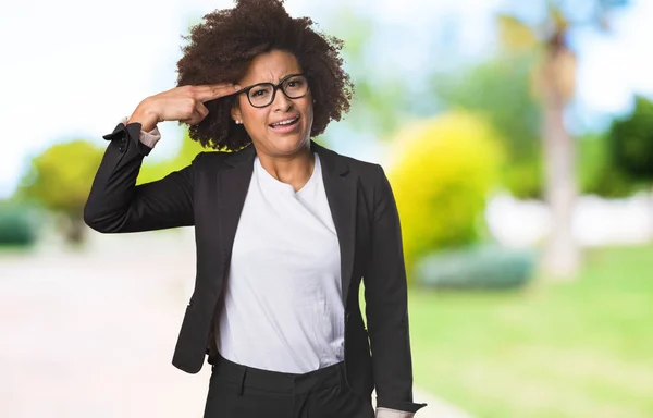 business black woman doing gun gesture