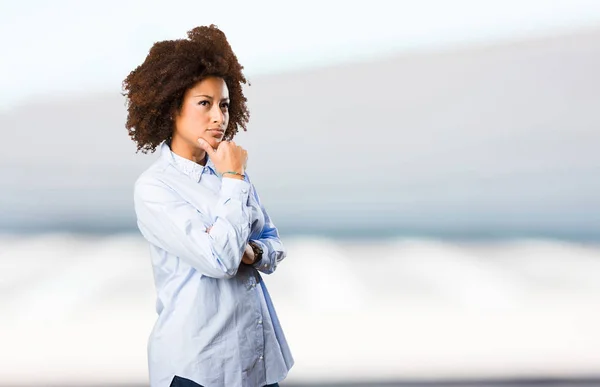 Young Black Woman Thinking Blurred Background — Stock Photo, Image