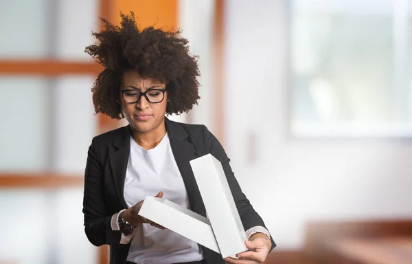 business black woman holding white box