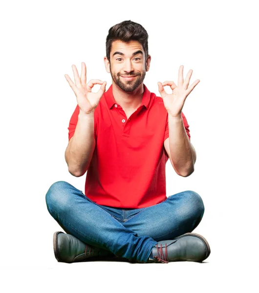 Man Sitting Doing Okay Gesture Isolated White Background — Stock Photo, Image