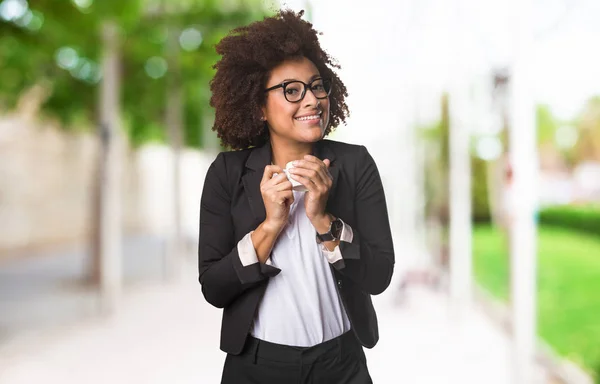 black business woman holding a cup of coffee on blurred background