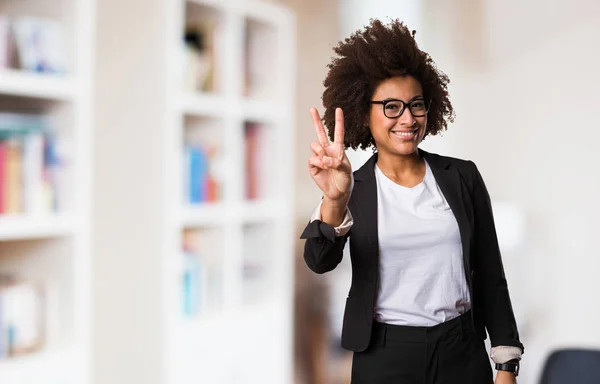 business black woman doing victory gesture