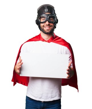 Beyaz arka plan üzerinde izole bir beyaz kopyalama alanı afiş tutarak süper kahraman