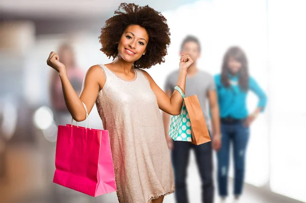 Young Black Woman Holding Shopping Bags Blurred People Background — Stock Photo, Image