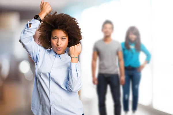 Young Black Woman Doing Winner Gesture Blurred People Background — Stock Photo, Image