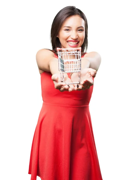 Asian Woman Red Dress Offering Shopping Cart — Stock Photo, Image