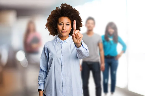 Young Black Woman Doing Number One Gesture Blurred People Background — Stock Photo, Image