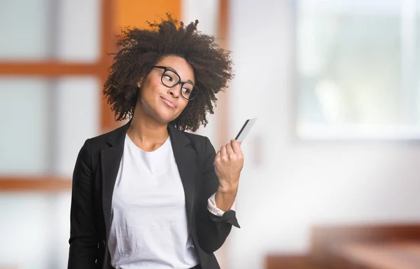 business black woman holding credit card