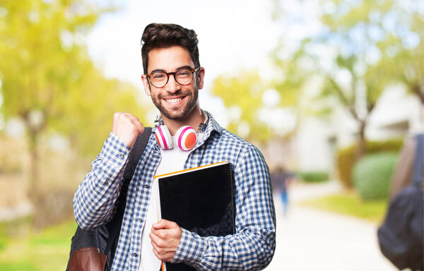 student man holding a book
