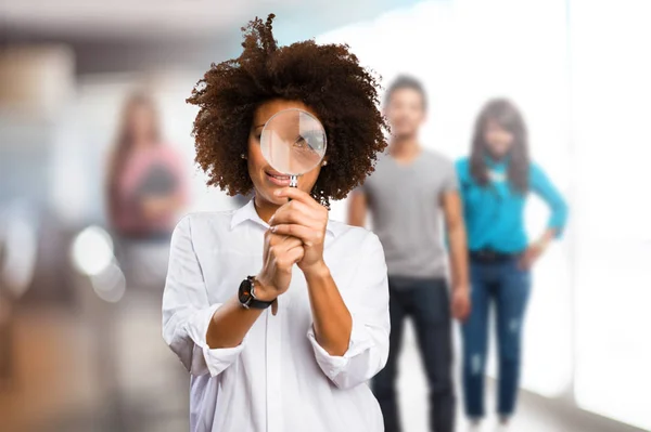 Young Black Woman Looking Magnifying Glass Blurred People Background — Stock Photo, Image