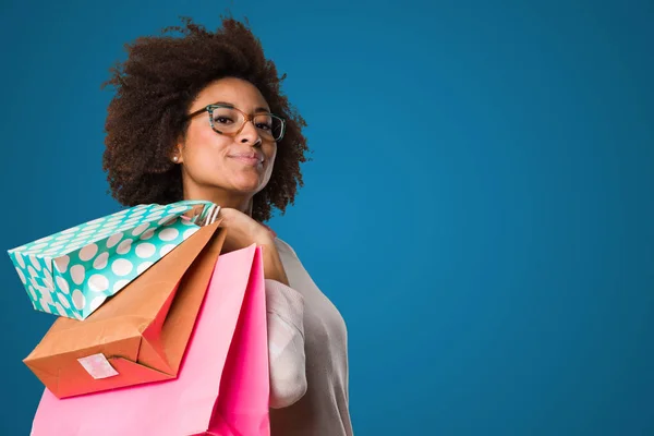 black woman holding shopping bags