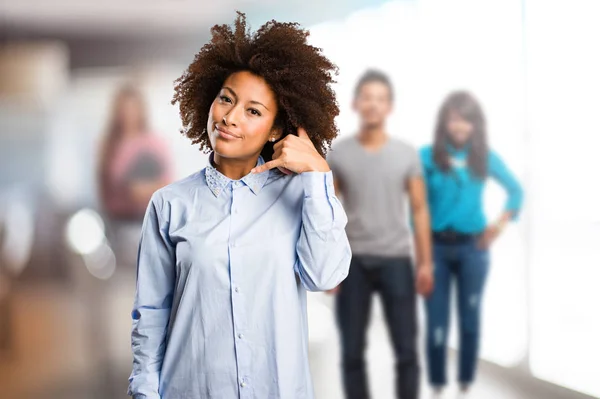 Young Black Woman Doing Telephone Gesture Blurred People Background — Stock Photo, Image