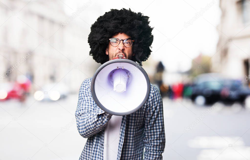 afro man shouting by megaphone