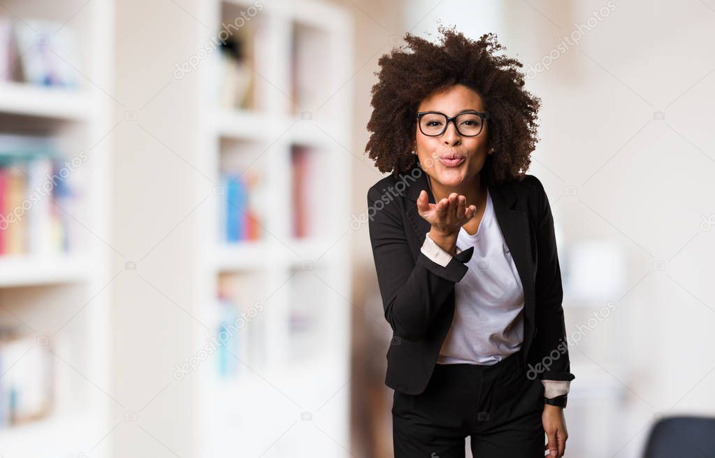business black woman sending kisses