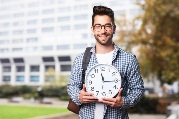 Estudiante Hombre Sosteniendo Reloj Sobre Fondo Borroso —  Fotos de Stock