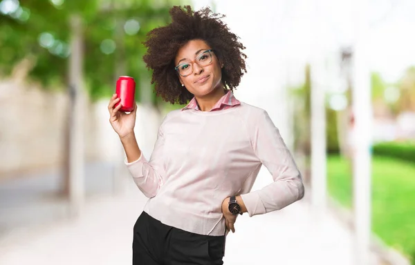 black woman holding coke, selective focus