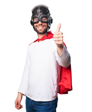 Beyaz arka plan üzerinde izole iyi jest yapıyor süper kahraman