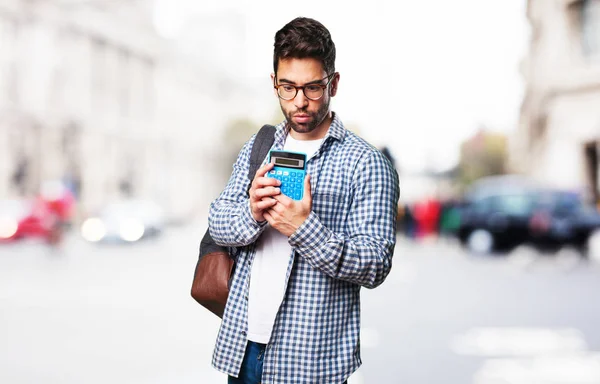 Estudiante Hombre Sosteniendo Una Calculadora — Foto de Stock