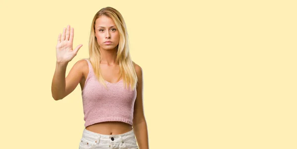 stock image Portrait of young pretty blonde woman putting hand in front