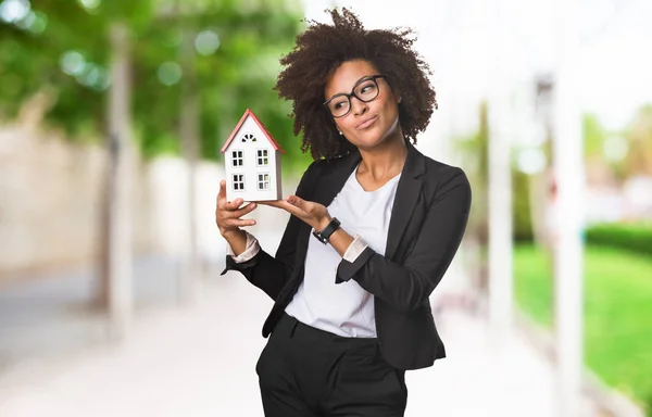 Black Business Woman Holding Small House Blurred Background — Stock Photo, Image