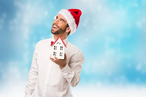 Young man wearing a santa claus hat on Christmas day