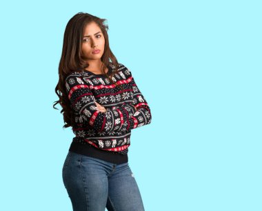 Full body young woman wearing a christmas jersey looking straight ahead clipart