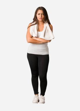Full body young fitness curvy woman crossing arms relaxed clipart
