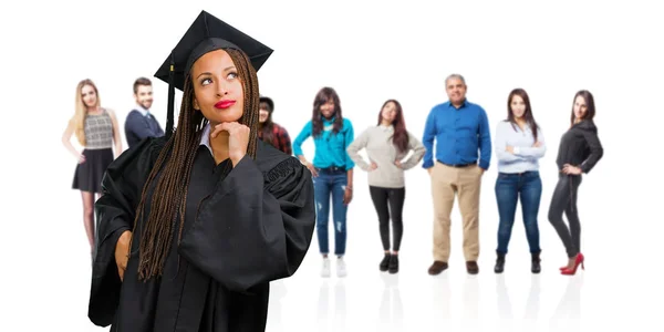Young Graduated Black Woman Wearing Braids Thinking Looking Confused Idea — Stock Photo, Image