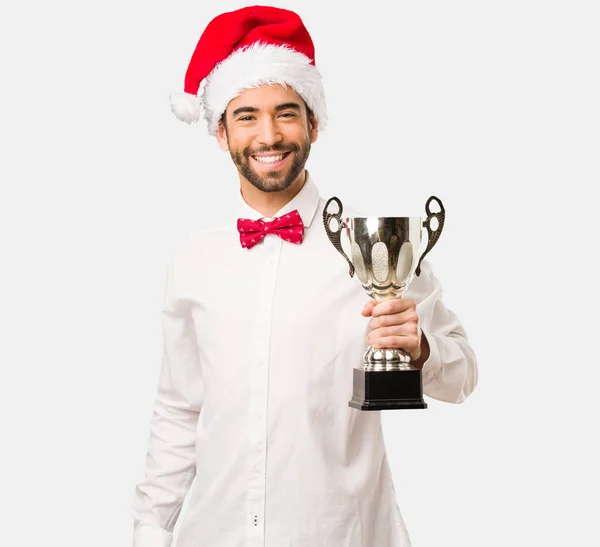 Man Santa Hat Holding Trophy — Stock Photo, Image