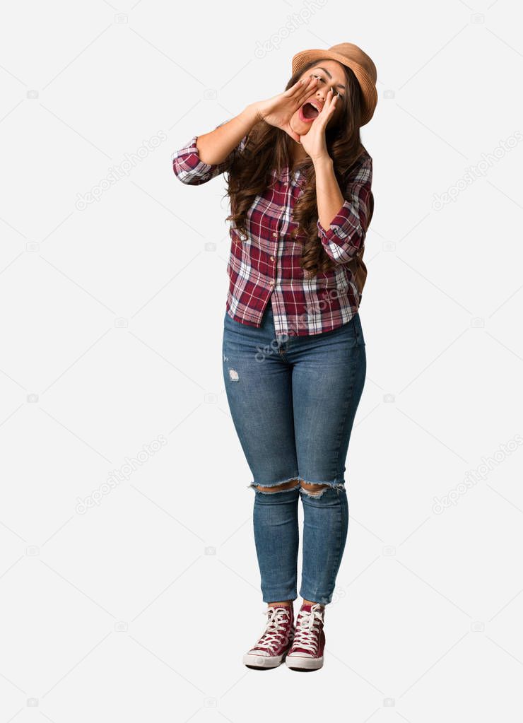 Full body young traveler curvy woman shouting something happy to the front