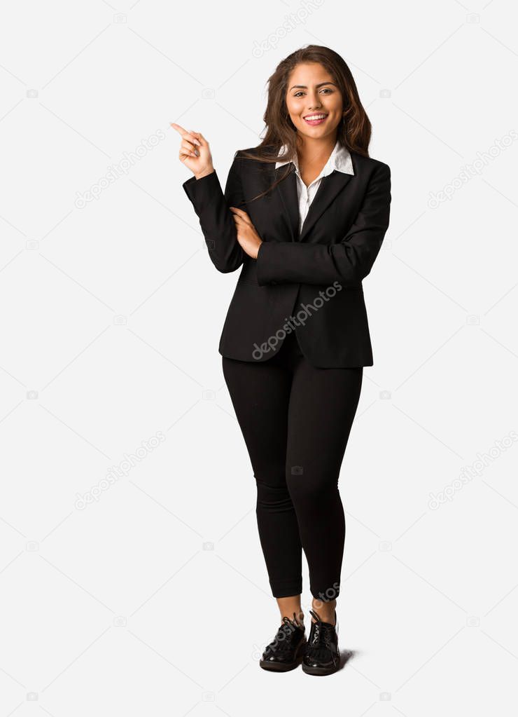 Full body young busines woman pointing to the side with finger