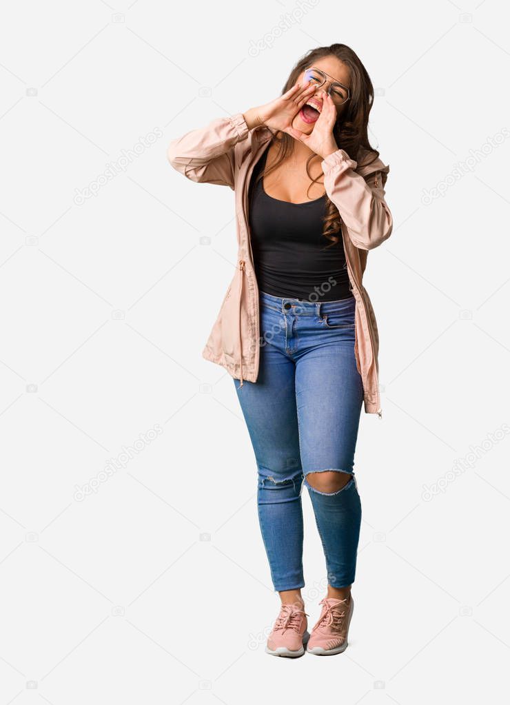 Full body young curvy woman shouting something happy to the front