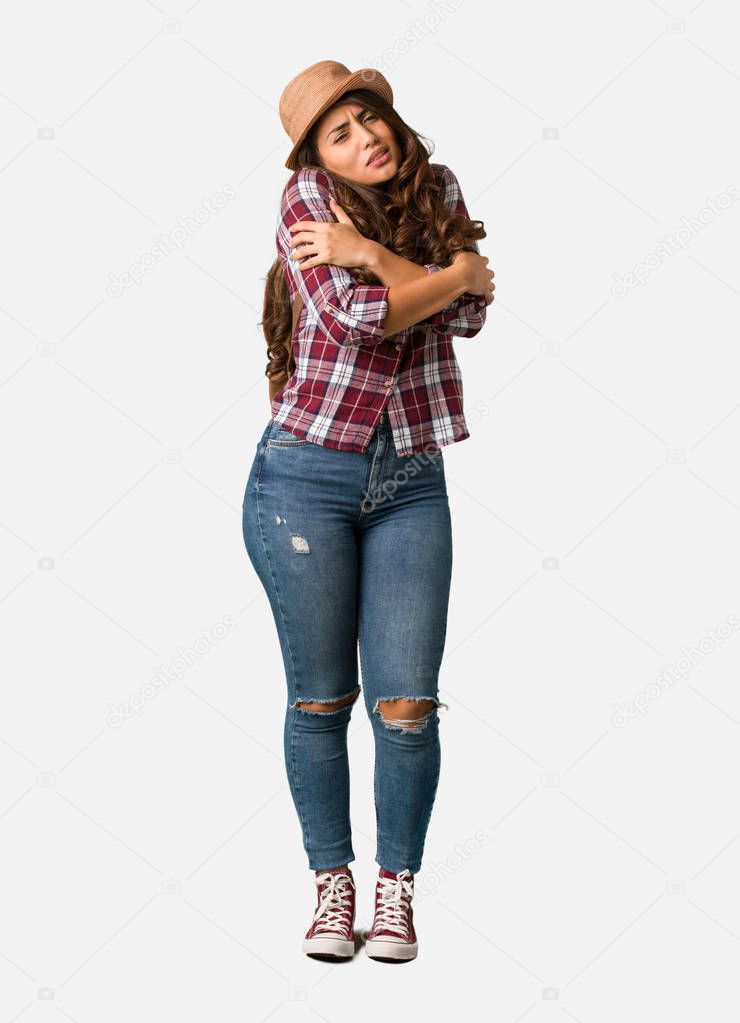Full body young traveler curvy woman going cold due to low temperature