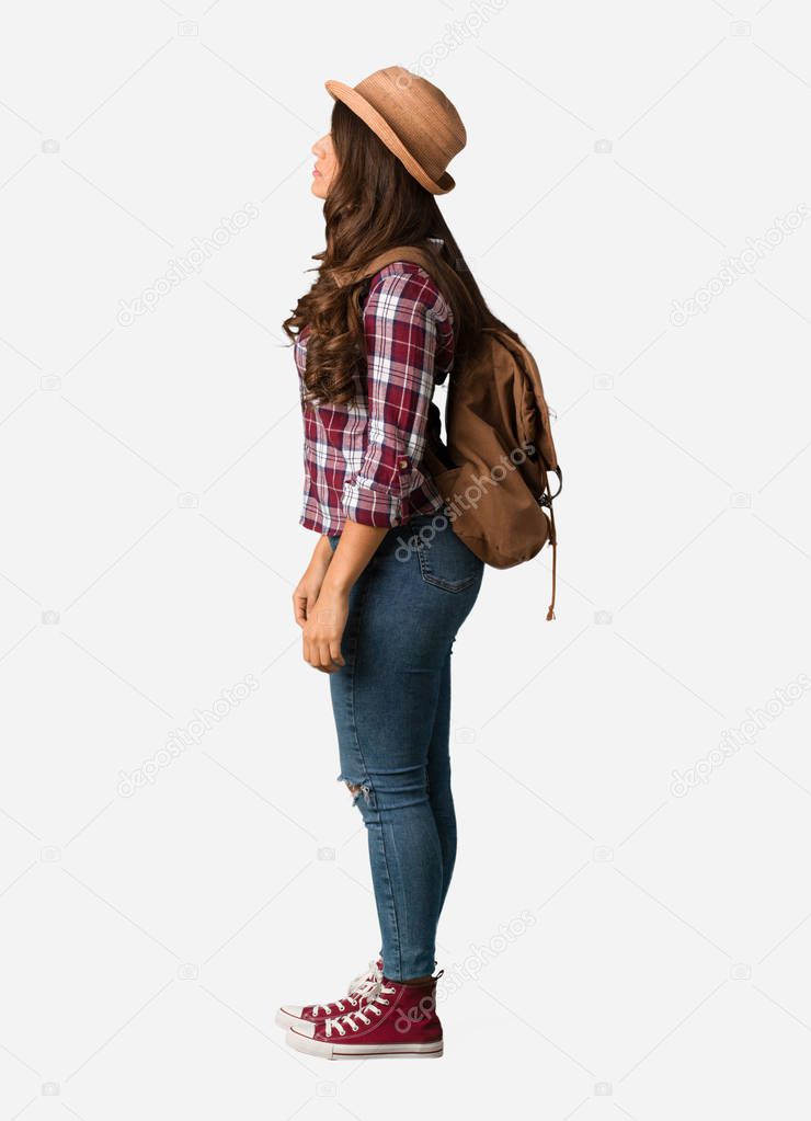 Full body young traveler curvy woman on the side looking to front