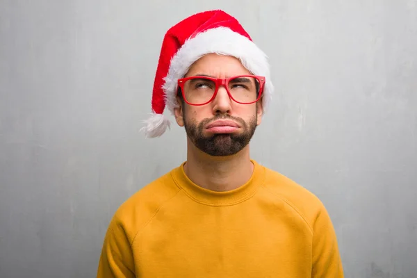 Young Man Celebrating Christmas Day Holding Gifts Tired Bored — Stock Photo, Image