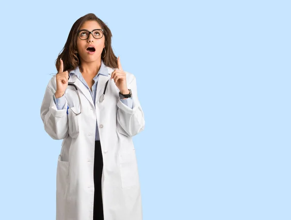 Full Body Young Doctor Woman Surprised Pointing Show Something — Stock Photo, Image