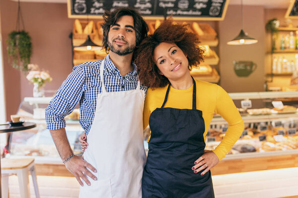 Young entrepreneur couple, they have just opened their bakery.