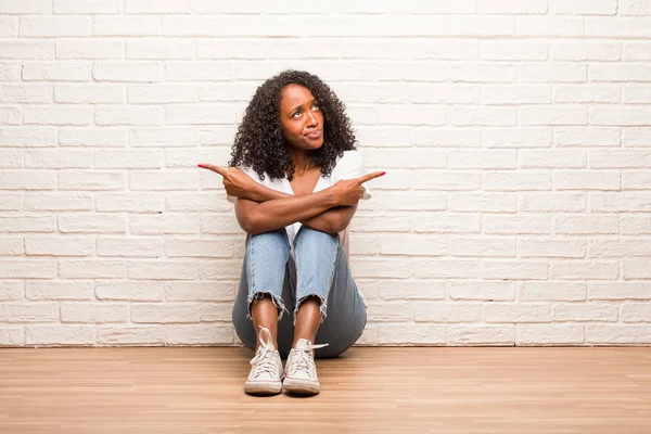 Young Black Woman Sitting Wooden Floor Confused Doubtful Man Decide — Stock Photo, Image