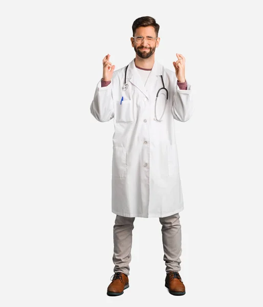 Young Doctor Man Crossing Fingers Having Luck — Stock Photo, Image