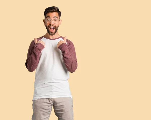 Young Handsome Man Surprised Feels Successful Prosperous — Stock Photo, Image