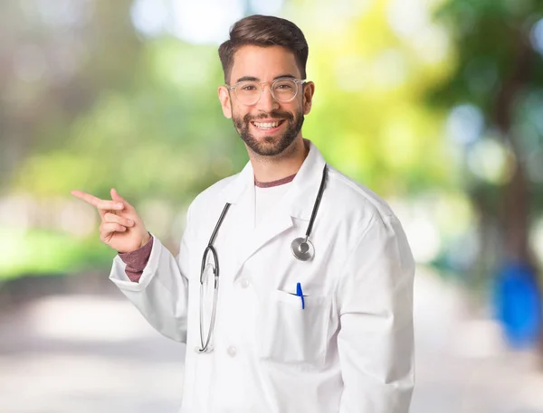 Young Doctor Man Pointing Side Finger — Stock Photo, Image