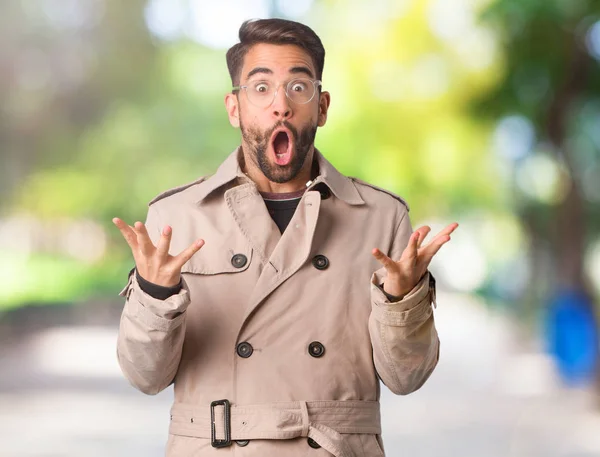 Young Man Wearing Trench Coat Celebrating Victory Success — Stock Photo, Image