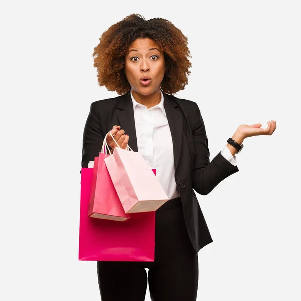 Young Black Woman Holding Shopping Bags Holding Something Palm Hand — Stock Photo, Image